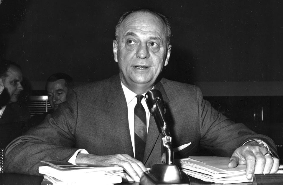 FILE - In this April 9, 1965 file photo, Surgeon General Luther Terry testifies on Capitol Hill in Washington before the House Commerce Committee hearing on proposed labeling of cigarette packages. Sixty years ago, the U.S. surgeon general released a report that settled a longstanding public debate about the dangers of cigarettes and led to huge changes in smoking in America. Some public health experts say a similar report could help clear the air about vaping. (AP Photo/File)