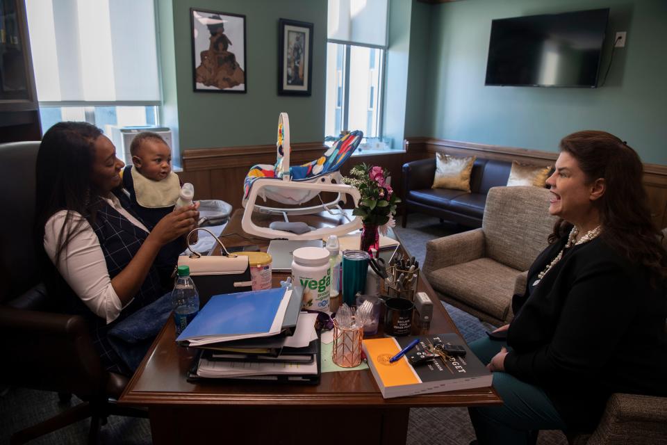 Sen. London Lamar D- Memphis, holds her 7-month-old son Nylinn, while speaking with Sen. Dawn White, R- Murfreesboro, at Cordell Hull State Office Building in Nashville, Tenn., Wednesday, Feb. 14, 2024.