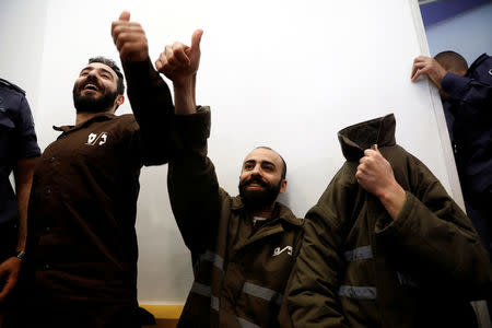 Romain Franck, an employee of the French consulate-general in Jerusalem, appears with co-defendants in the district court in Beersheba, Israel, March 19, 2018. REUTERS/Amir Cohen