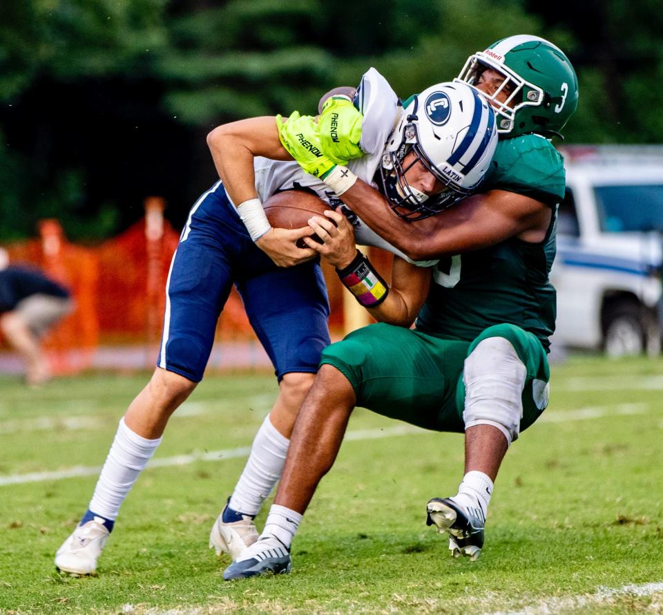 Christ School junior linebacker Josh Harrison sacks Charlotte Latin sophomore quarterback Charlie Smith Friday night at Christ School in Arden, N.C. Charlotte Latin defeated Christ School 10-6.