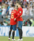 <p>Andres Iniesta, in his 133rd likely his last match as a Spain player, commiserates with Gerard Pique </p>
