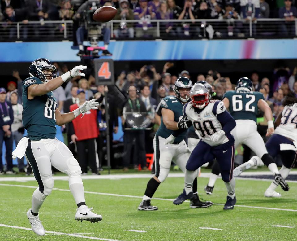 Eagles tight end Trey Burton, left, throws a touchdown pass to Nick Foles to complete the 'Philly Special' in the 41-33 Super Bowl LII victory over the Patriots.