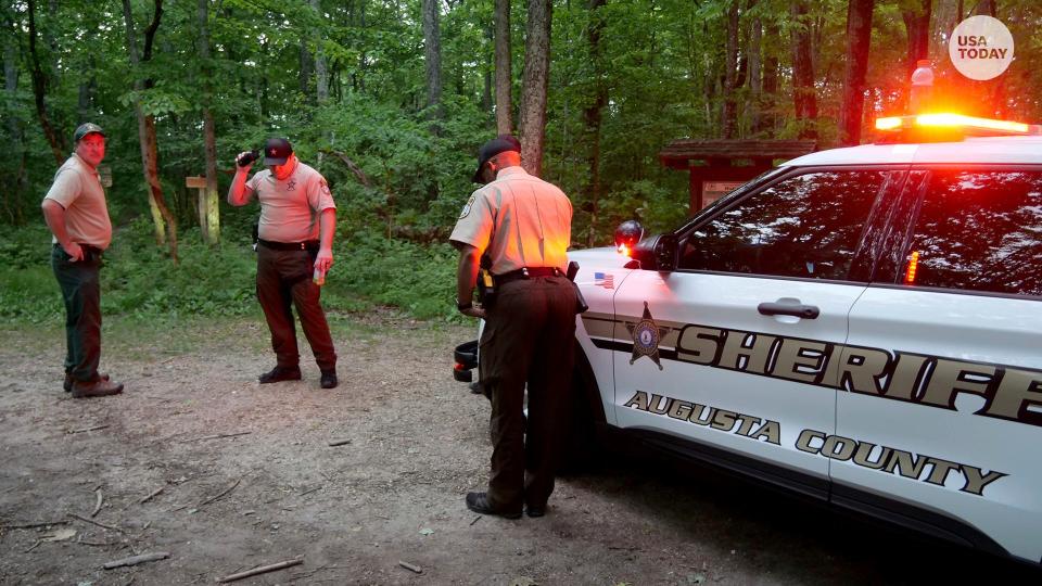 Authorities secure the entrance to Mine Bank Trail, an access point to the rescue operation along the Blue Ridge Parkway where a Cessna Citation crashed over mountainous terrain near Montebello, Va., Sunday, June 4, 2023.