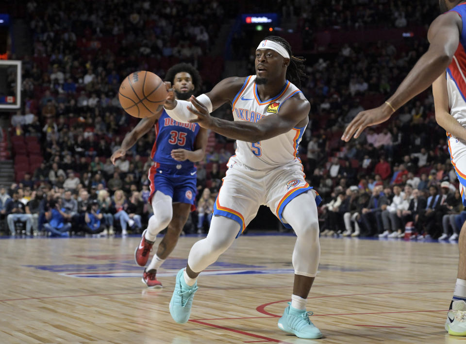 Oct 12, 2023; Montreal, Quebec, CAN; Oklahoma City Thunder guard Luguentz Dort (5) passes the ball during the first quarter against the Detroit Pistons at the Bell Centre. Mandatory Credit: Eric Bolte-USA TODAY Sports