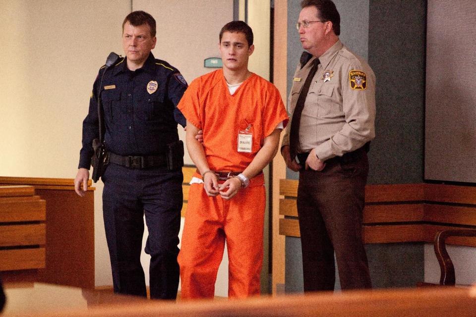 This film image released by Summit Entertainment shows Rafi Gavron, center, in a scene from "Snitch." (AP Photo/Summit Entertainment, Steve Dietl)