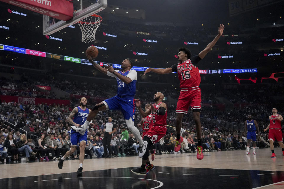 Los Angeles Clippers guard Norman Powell (24) goes to the basket against Chicago Bulls forward Julian Phillips (15) during the first half of an NBA basketball game in Los Angeles, Saturday, March 9, 2024. (AP Photo/Eric Thayer)