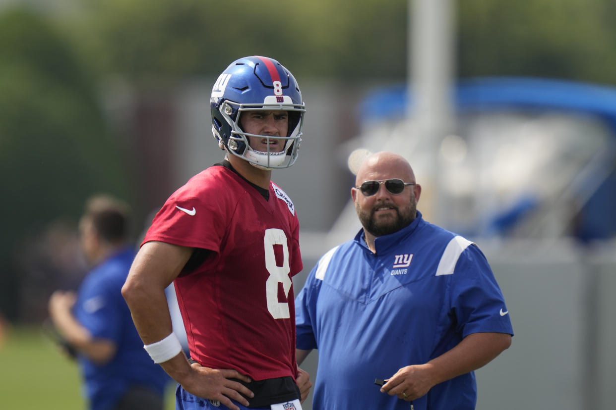 New York Giants quarterback Daniel Jones, left, and head coach Brian Daboll look over the field during a practice at the NFL football team's training facility in East Rutherford, N.J., Thursday, July 27, 2023. (AP Photo/Seth Wenig)