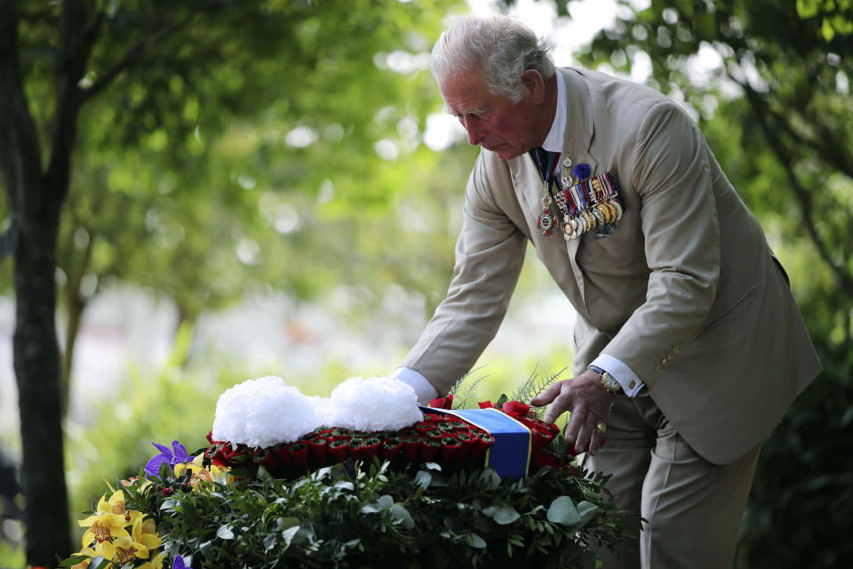 Britain's Prince Charles lays a wreath during the national service of remembrance marking the 75th anniversary of V-J Day at the National Memorial Arboretum in Alrewas, England, Saturday Aug. 15, 2020. Following the surrender of the Nazis on May 8, 1945, V-E Day, Allied troops carried on fighting the Japanese until an armistice was declared on Aug. 15, 1945. (Anthony Devlin/PA via AP)