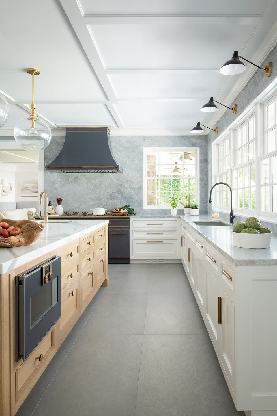 kitchen galley with island on one side and countertop on the other