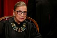 FILE PHOTO: Ginsburg participates in taking a new family photo with her fellow justices at the Supreme Court building in Washington