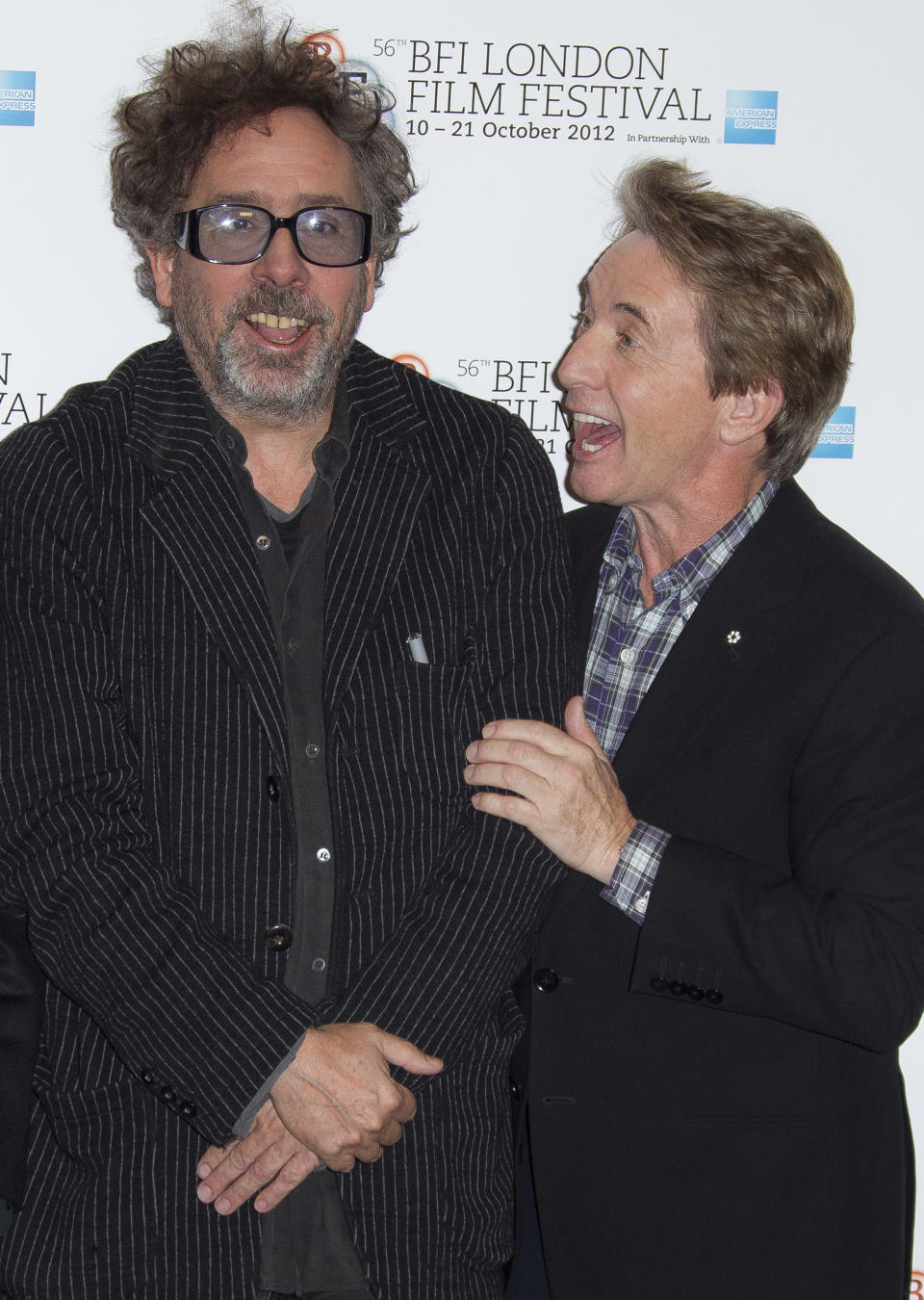 Director Tim Burton and actor Martin Short react during a photocall for Burton's "Frankenweenie" during the London Film Festival at The Odeon, Leicester Square on Wednesday, October 10, 2012 in London. (Photo by Joel Ryan/Invision/AP)