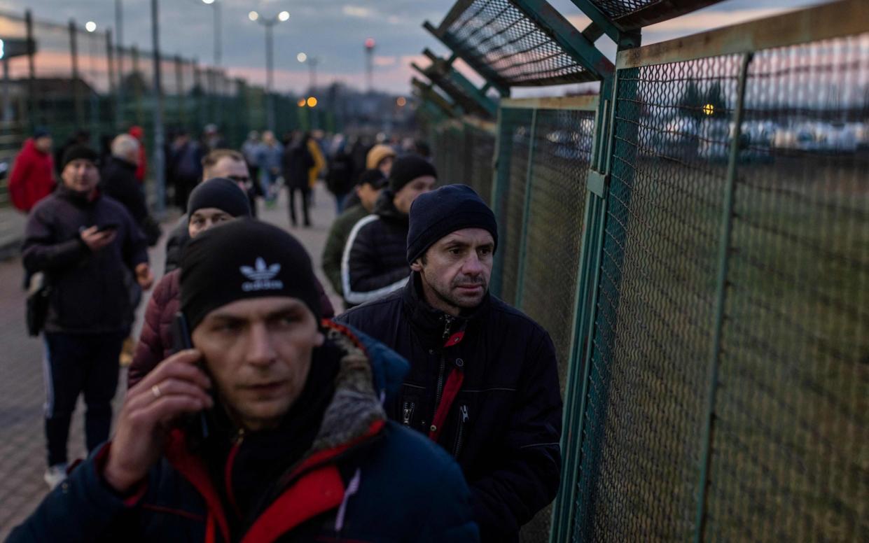 Ukrainian citizens are seen arriving at the Medyka pedestrian border crossing in eastern Poland