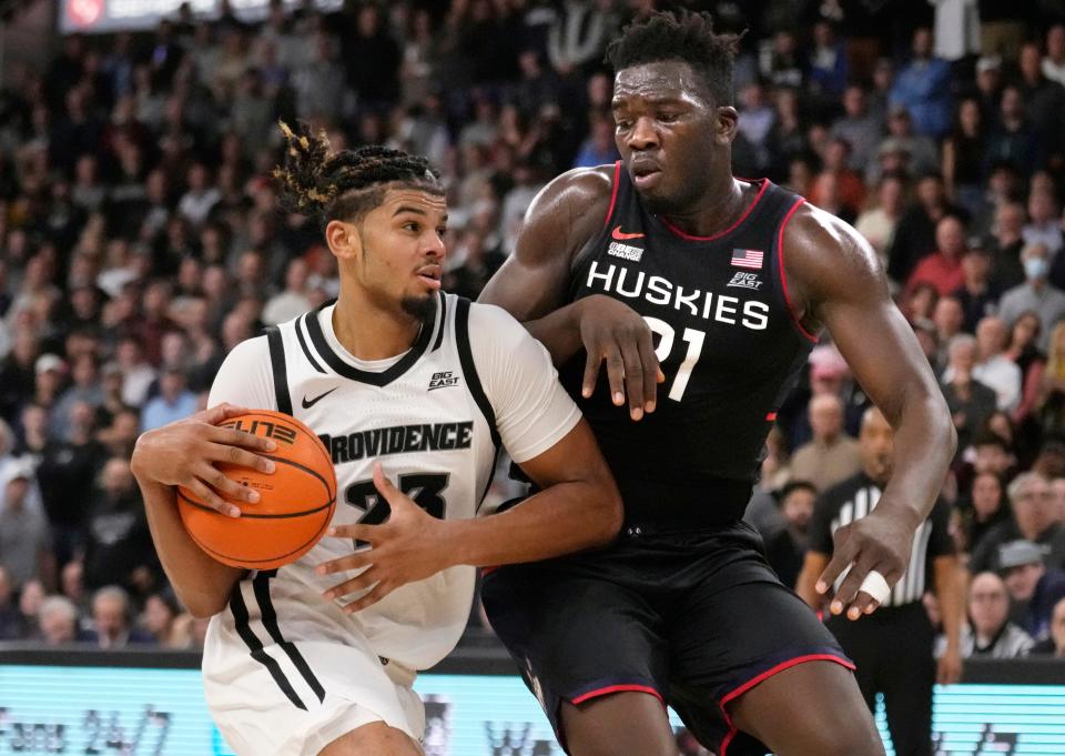 Providence forward Bryce Hopkins (23) drives to the basket against Connecticut forward Adama Sanogo during the second half of their Jan. 4 game.