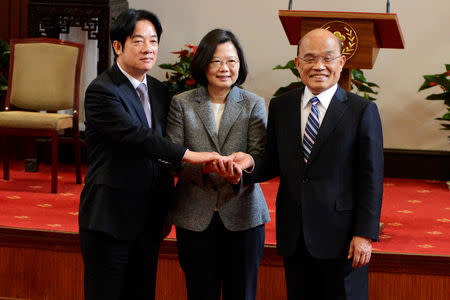 (L-R) Former premier William Lai, Taiwan President Tsai Ing-wen and new premier Su Tseng-chang join hands after a news conference in Taipei, Taiwan January 11, 2019. REUTERS/Fabian Hamacher