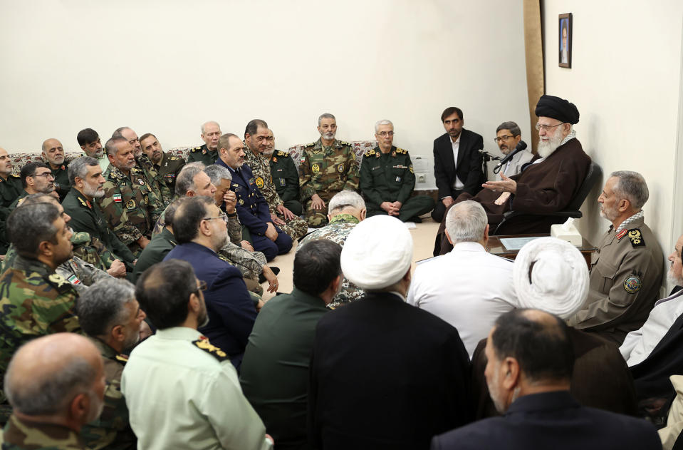 In this photo released by the official website of the office of the Iranian supreme leader, Supreme Leader Ayatollah Ali Khamenei, right, speaks in his meeting with a group of senior military leaders, in Tehran, Iran, Sunday, April 21, 2024. Iran's supreme leader on Sunday dismissed any discussion of whether Tehran's unprecedented drone-and-missile attack on Israel hit anything there, a tacit acknowledgment that despite launching a massive assault, few projectiles actually made through to their targets. (Office of the Iranian Supreme Leader via AP)