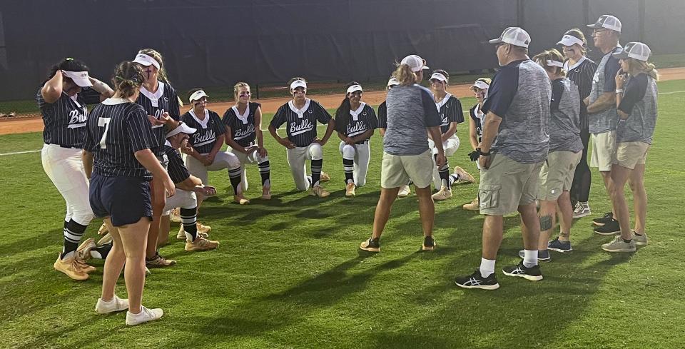 Parrish Community softball coach Erin Spivey speaks with her team after a 1-0 victory over Tampa Catholic in the Class 3A regional tournament.