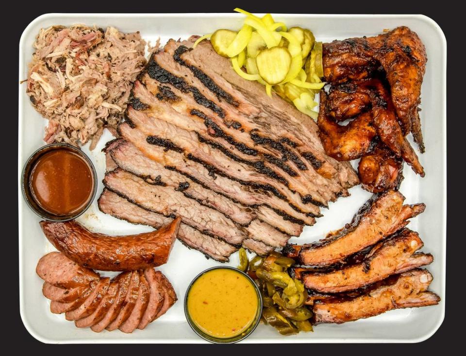 The Smoke Pit’s barbecue offerings include hickory smoked pulled pork, Texas brisket, smoked chicken quarters, smoked sausage and ribs. Three 23 Marketing