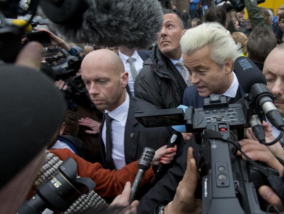 Firebrand int-islam lawmaker Geert Wilders talks to media during an election campaign stop in Spijkenisse, near Rotterdam, Netherlands, Saturday Feb. 18, 2017. Now, as a March 15 parliamentary election looms, the political mood is turning inward as Wilders dominates polls with an isolationist manifesto that calls for the Netherlands "to be independent again. So out of the EU." (AP Photo/Peter Dejong)