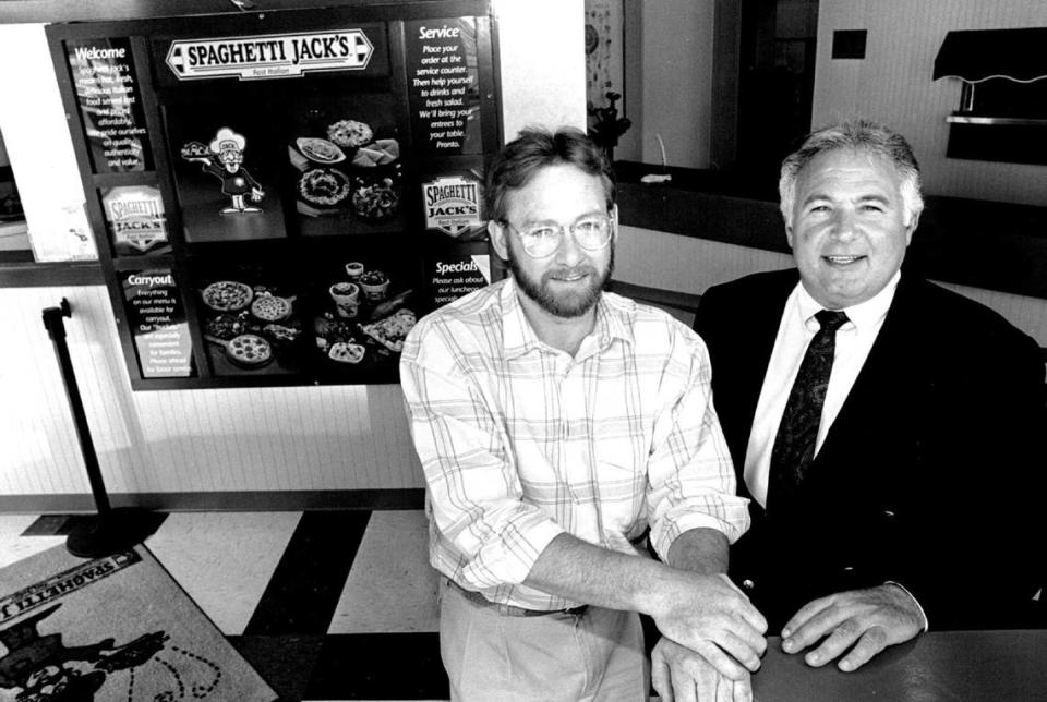 Both Sub & Stuff and Spaghetti Jack’s were founded by Louis Stoico, pictured at right in this 1992 photo. Gary L. Poulton, left, served as the executive vice president of Stoico Food Services and went on to found Hog Wild Pit Bar-B-Q.