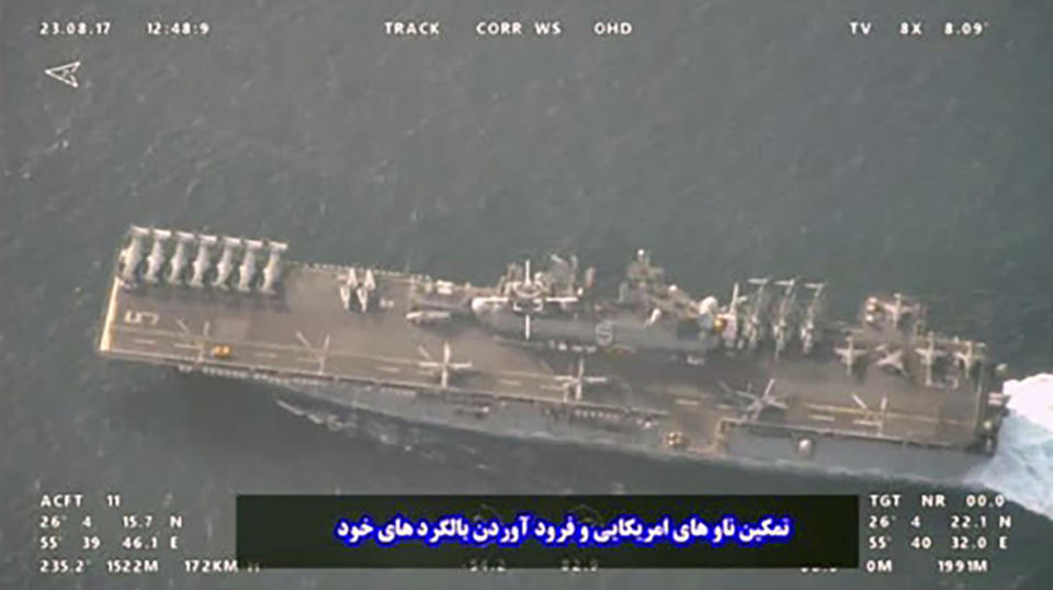 This image provided by the Iranian Revolutionary Guard via Tasnim News Agency on Sunday, Aug. 20, 2023, shows the USS Bataan at the Strait of Hormuz, in the mouth of the Persian Gulf. (Iranian Revolutionary Guard/Tasnim News Agency via AP)