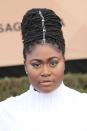 <p>All eyes were on the ‘Orange Is The New Black’ star as she opted for a quirky up-do, complete with a hair charm. Some rather striking green eye makeup completed the look. [Photo: Getty] </p>