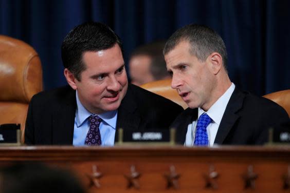 Devin Nunes, Republican ranking member of the House Intelligence Committee, left, confers with Republican staff attorney Steve Castor during the impeachment hearing evidence of Fiona Hill and David Holmes (AP)