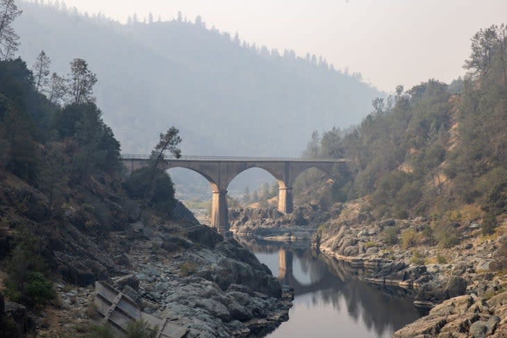 <span class="article__caption">A view of No Hands Bridge in Auburn of El Dorado County as the Mosquito Fire continued in California, United States on September 11, 2022. (Photo by Tayfun Coskun/Anadolu Agency via Getty Images)</span>