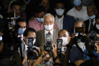 Former Malaysian Prime Minister Najib Razak, leaves the court house in Kuala Lumpur, Malaysia, Tuesday, July 28, 2020. The court has sentenced Najib to serve 12 years in prison after finding him guilty in the first of several corruption trials linked to the multibillion-dollar looting of a state investment fund that brought down his government two years ago. (AP Photo/Vincent Thian)