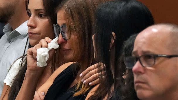 Patricia Padauy Oliver is comforted as a witness testifies to her son's fatal injuries during the penalty phase of the trial of Marjory Stoneman Douglas High School shooter Nikolas Cruz, in Fort Lauderdale, Fla., Aug. 1, 2022. (Amy Beth Bennett/South Florida Sun Sentinel/POOL/AFP via Getty Images)