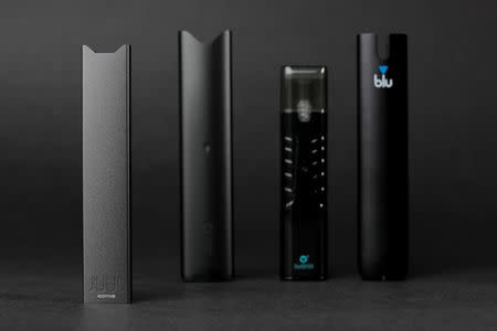 An electronic cigarette device made by JUUL (L) is shown next to other similar devices (R to L) Myblu, Suorin ishare and Vuse Alto in this photo illustration taken September 20, 2018. REUTERS/Mike Blake/Illustration