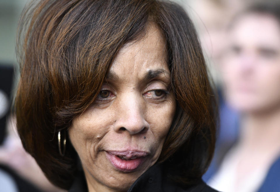 FILE - In this Feb. 27, 2020, file photo, former Baltimore Mayor Catherine Pugh leaves her sentencing hearing at U.S. District Court in Baltimore. Pugh was sentenced to three years in federal prison for arranging fraudulent sales of her self-published children's books to nonprofits and foundations to promote her political career. Pugh is expected to plead guilty to perjury. A plea hearing on the state misdemeanor charge is scheduled Friday in Anne Arundel County Circuit Court in Annapolis. (AP Photo/Steve Ruark, File)