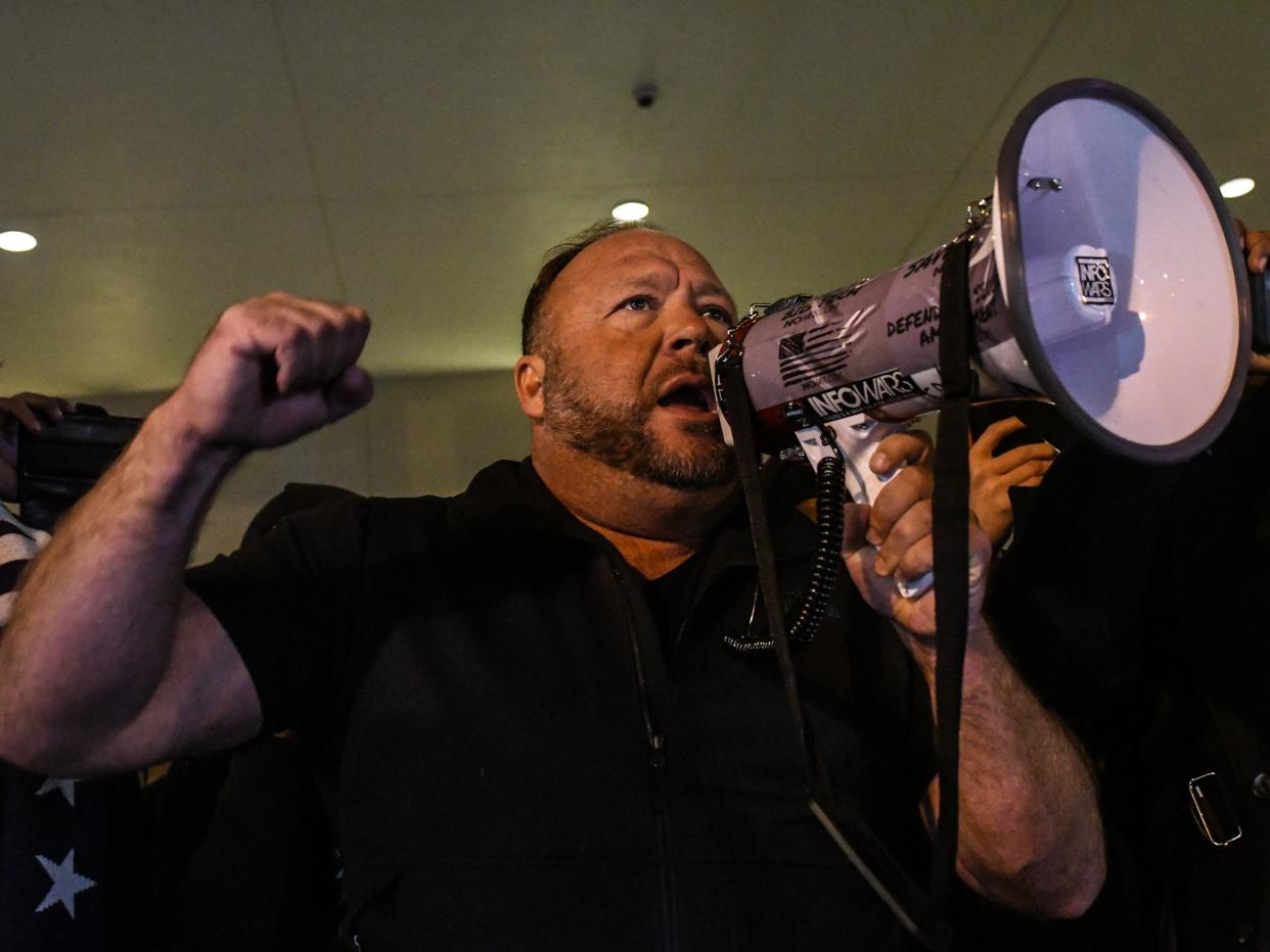 Alex Jones speaks to supporters of President Donald Trump during a protest on 12 December, 2020 in Washington, DC (Getty Images)