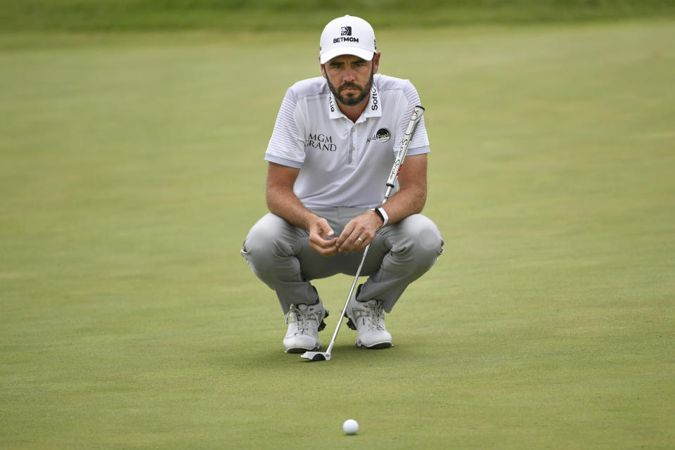 Troy Merritt lines up a shot on the 18th hole during the first round of the 3M Open golf tournament in Blaine, Minn., Thursday, July 22, 2021. (AP Photo/Craig Lassig)