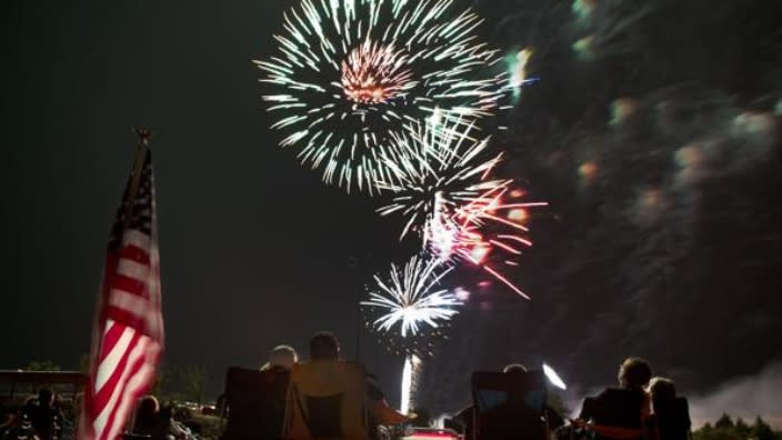 Spectators watch as fireworks explode overhead during a Fourth of July celebration in 2013 in Prescott, Arizona. The city of Phoenix cited supply chain issues in canceling its three major Independence Day fireworks shows. (Photo: Julie Jacobson/AP, File)