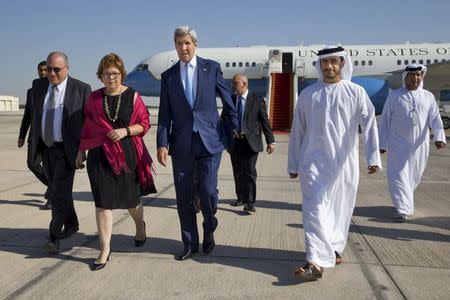 U.S. Secretary of State John Kerry walks with Deputy Chief of Mission at the U.S. Embassy in Abu Dhabi Ethan Goldrich (L), U.S. Ambassador to the United Arab Emirates Barbara Leaf (2nd L) and UAE's Foreign Minister Sheikh Abdullah bin Zayed Al Nahyan (front R) on arrival in Abu Dhabi, November 23, 2015. REUTERS/Jacquelyn Martin/Pool