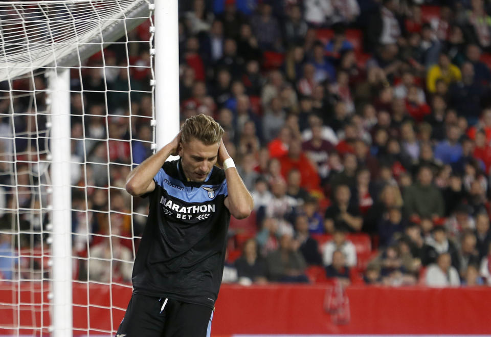 Lazio's Ciro Immobile reacts after missing a chance to score during the Europa League round of 32 second leg soccer match between Sevilla and Lazio at the Sanchez Pizjuan stadium, in Seville, Spain, Wednesday, Feb. 20, 2019. (AP Photo/Miguel Morenatti)