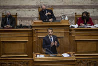 Greek Prime Minister Kyriakos Mitsotakis speaks during a parliamentary session in Athens, Thursday, Feb. 25, 2021.Mitsotakis has promised to outline proposed legal changes in parliament on Thursday to make it easier for victims of sexual assault to report the crimes. (AP Photo/Petros Giannakouris)