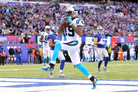 Dec 20, 2015; East Rutherford, NJ, USA; Carolina Panthers wide receiver Ted Ginn Jr. (19) scores a touchdown against the New York Giants during the third quarter at MetLife Stadium. Mandatory Credit: Brad Penner-USA TODAY Sports