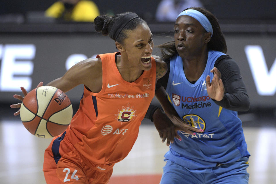 Connecticut Sun forward DeWanna Bonner drives against Chicago Sky guard Kahleah Copper 