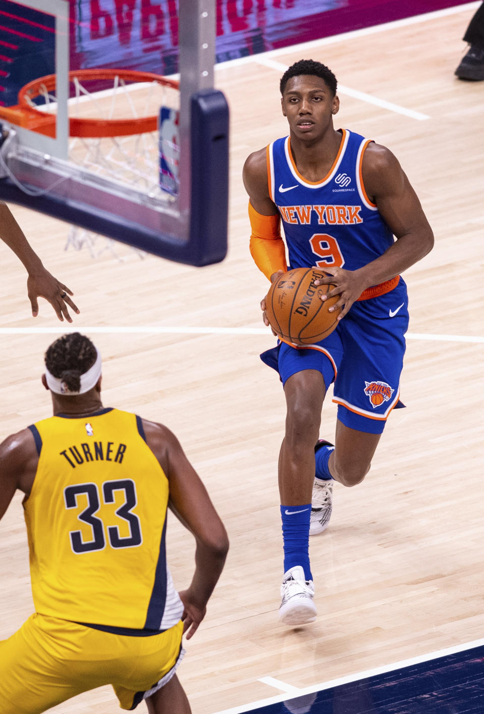 New York Knicks guard RJ Barrett (9) looks toward the basket as he makes a move during the second half of an NBA basketball game against the Indiana Pacers in Indianapolis, Saturday, Jan. 2, 2021. (AP Photo/Doug McSchooler)