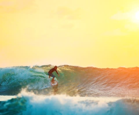 Surfing in Bali - Credit: GETTY