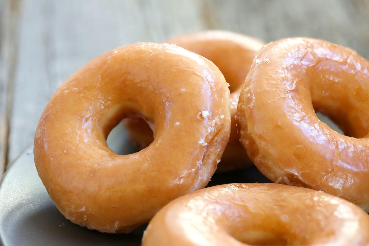 Glazed donuts background image. Macro with shallow dof.