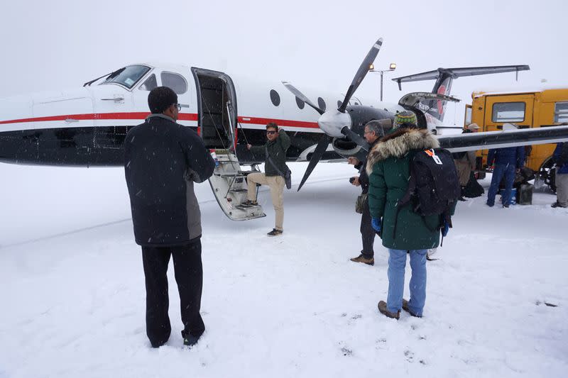 A RavnAir plane carrying tourists coming to view polar bears at the Inupiat village of Kaktovik lands at Barter Island