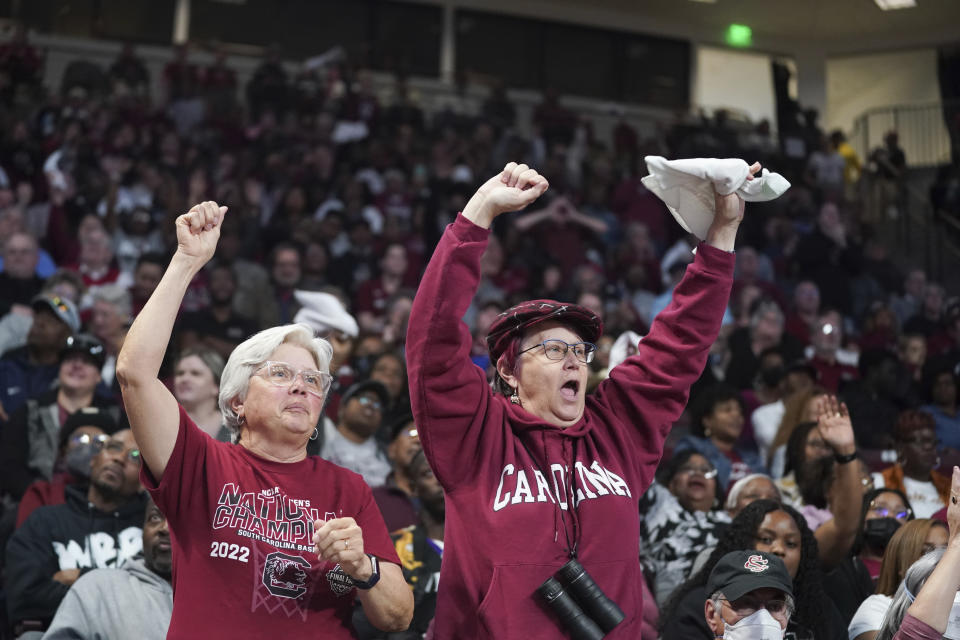 South Carolina fans cheer during a timeout in a women's second-round college basketball game against South Florida in the NCAA Tournament, Sunday, March 19, 2023, at Colonial Life Arena in Columbia, S.C. Women’s college basketball believes it has the makings for a hit reality TV show — star power driving a marketable product with a growing audience — and those engaged in the sport hope to give network execs another glimpse this weekend of why they need to ante up during March Madness. (AP Photo/Sean Rayford)