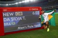 2016 Rio Olympics - Athletics - Final - Men's Pole Vault Final - Olympic Stadium - Rio de Janeiro, Brazil - 15/08/2016. Thiago Braz da Silva (BRA) of Brazil celebrates after setting a new Olympic record and winning the gold medal. REUTERS/Kai Pfaffenbach