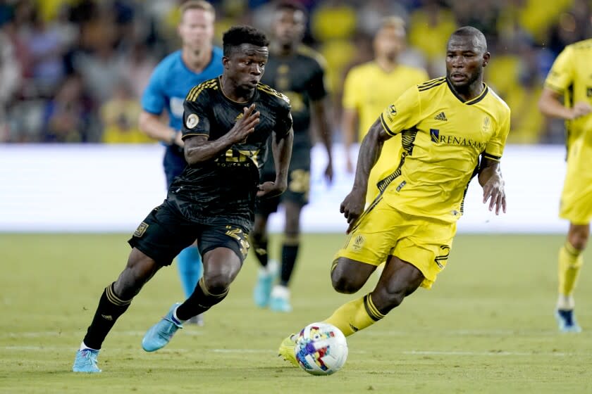 Los Angeles FC's Kwadwo Opoku, left, and Nashville SC's Brian Anunga.