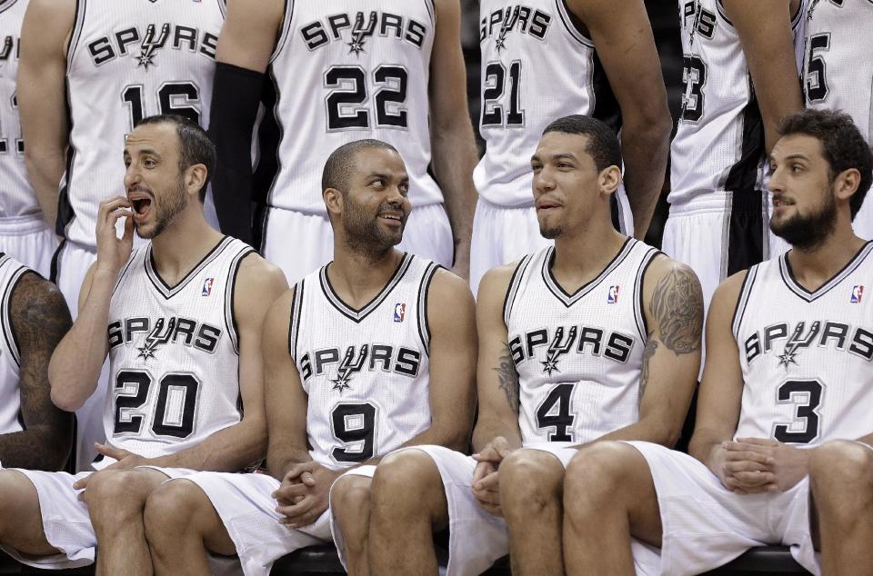 San Antonio Spurs' Manu Ginobili, of Argentina; Tony Parker, of France; Danny Green; and Marco Belinelli, of Italy, from left, take part in a team photo before an NBA basketball game against the Los Angeles Lakers, Wednesday, April 16, 2014, in San Antonio. (AP Photo/Eric Gay)