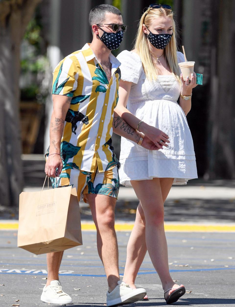<p>Joe Jonas and pregnant wife Sophie Turner twin in matching masks as they head to meet friends for lunch on Sunday in Los Angeles. </p>