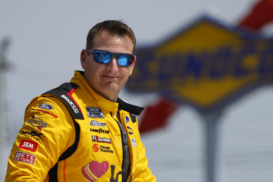 FILE - Michael McDowell smiles prior to a NASCAR Cup Series auto race in Watkins Glen, N.Y., Sunday Aug. 20, 2023. McDowell will not return to Front Row Motorsports after this season, he announced Wednesday morning, May 8, 2024. (AP Photo/Jeffrey T. Barnes, File)