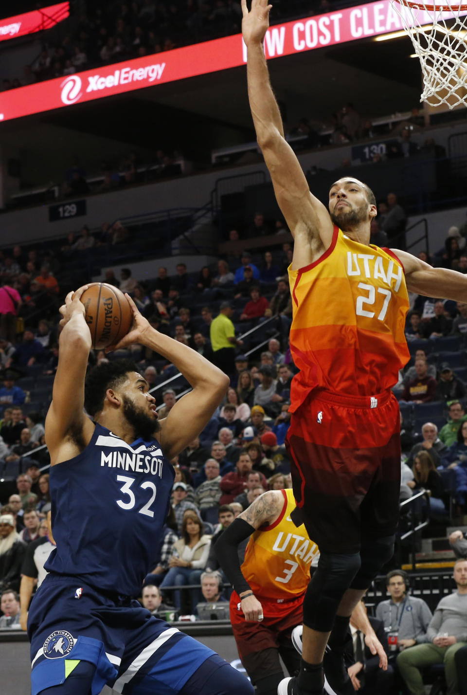 Utah Jazz's Rudy Gobert, right, of France, towers over Minnesota Timberwolves' Karl-Anthony Towns in the second half of an NBA basketball game Sunday, Jan. 27, 2019, in Minneapolis. (AP Photo/Jim Mone)